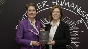 Sabine Herlitschka and Clara Neppel pose with the Digital Humanism in Practice Award